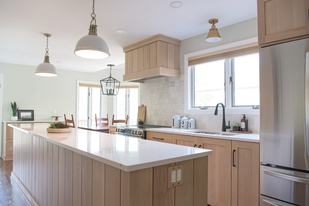 coastal kitchen with custom white oak cabinetry and cambria quartz white countertop