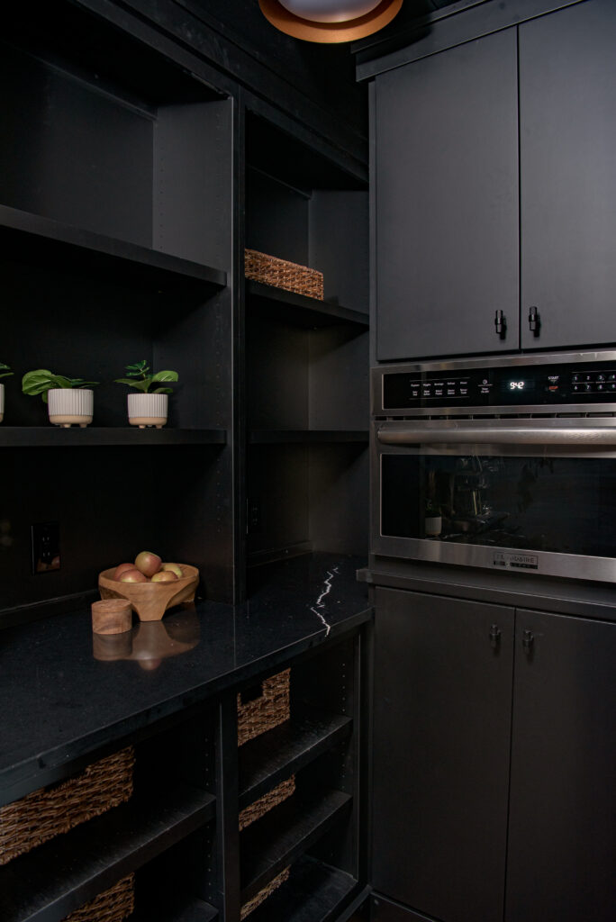 custom pantry with black cabinetry