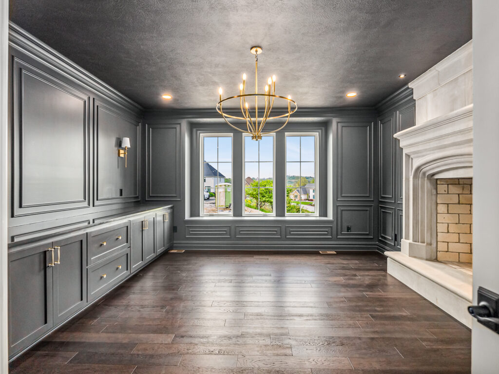 grey study with limestone fireplace